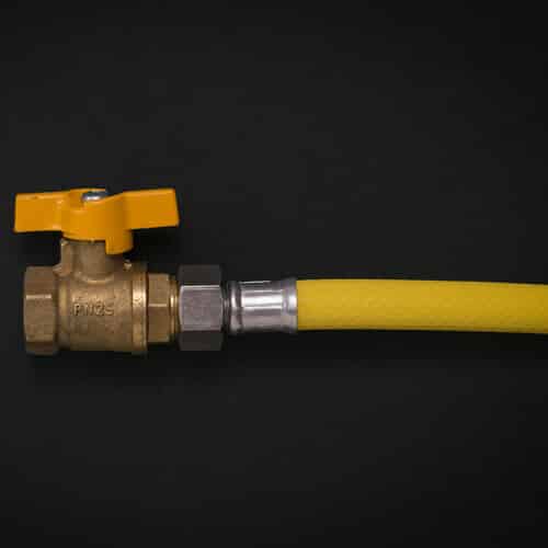 gas tap connected to a yellow hose