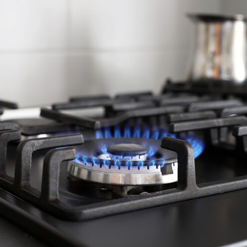 close-up of the blue flame on a gas stove