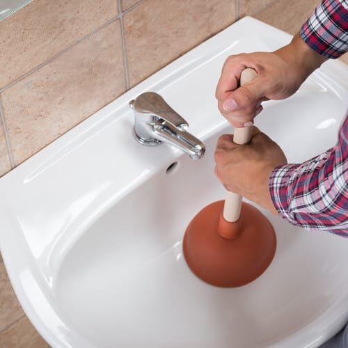 view from above of a sink being plunged